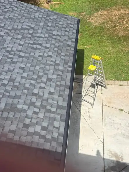 Ladder set at a Chattanooga roof edge for a gutter cleaning