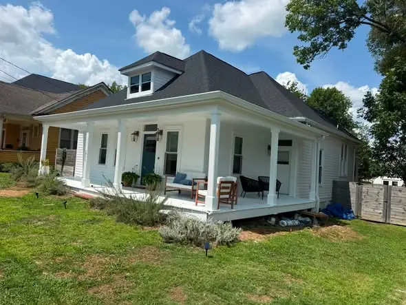 White seamless gutters on a Chattanooga porch home